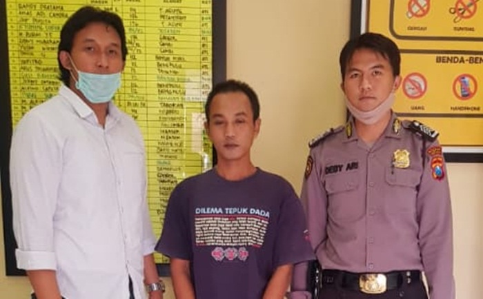 Tersangka WT diapit dua petugas. foto: ist