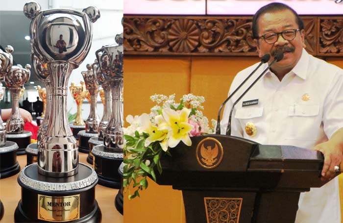 Gubernur Jatim Dr. H. Soekarwo dan trofi penghargaan Anugerah Parahita Ekapraya (APE) yang diraih.